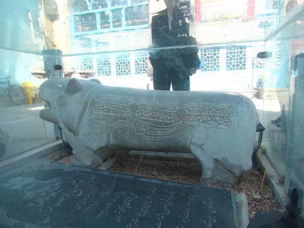 A stone lion in the courtyard of Emamzadeh Ahmad Tomb
