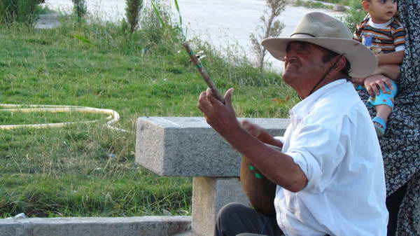 A badger musician in the courtyard of Ferdowsi's tomb