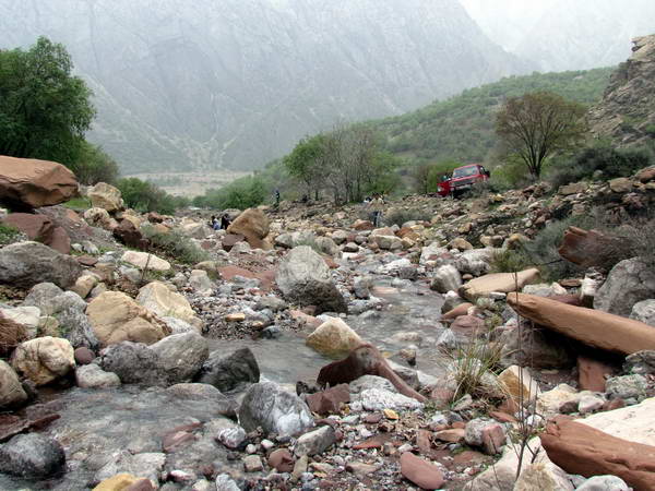 Darreh Eshq with beautiful colored rocks in bed of river