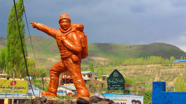 Statue of a mountaineer in the city of Plour on the southern slope of Damavand Mountain