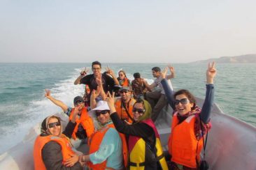 We are riding boat towards dolphins place in the sea around Hengam Island