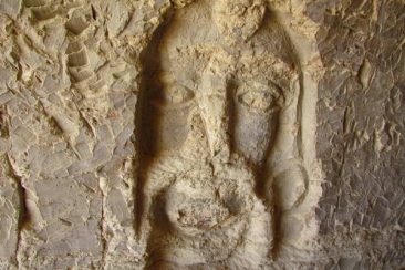 Carvings on the walls of Khorbas cave