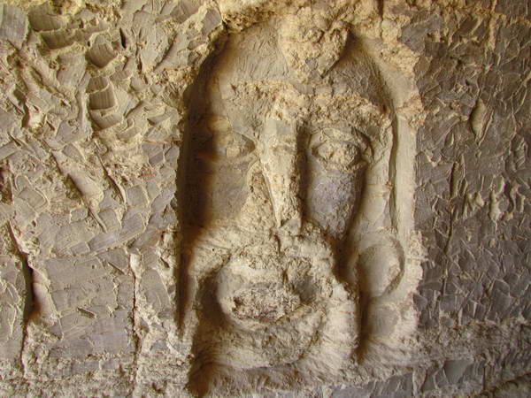 Carvings on the walls of Khorbas cave