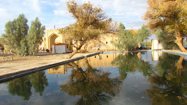 Karshahi Caravanserai with an aqueduct and a pond near it