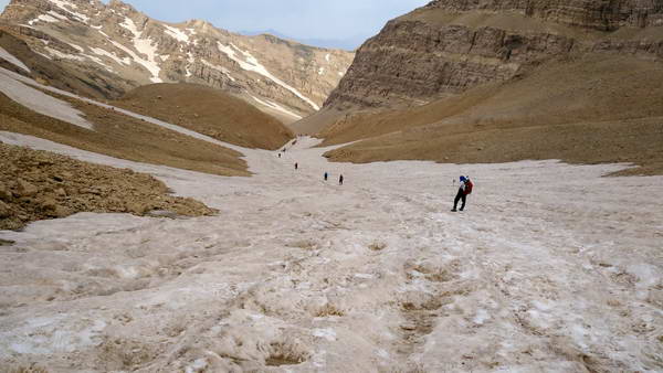 Walking over glaciers In the way to climb Kolunchin, the highest peak of Zardkooh mountain